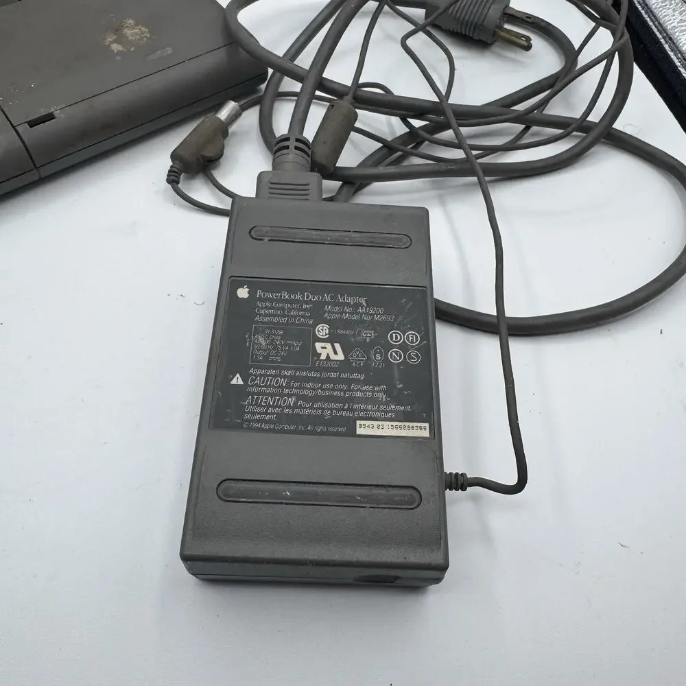 Vintage Apple Macintosh PowerBook Duo 2300c PowerPC Laptop Powers On AC Adapter